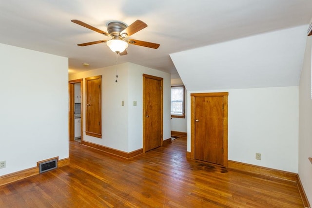 bonus room with ceiling fan, lofted ceiling, and dark hardwood / wood-style flooring