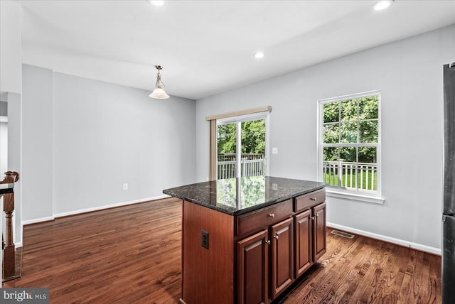 4631 Alliance Way, Fredericksburg, VA 22408 - kitchen featuring dark wood-style floors, dark stone counters, recessed lighting, pendant lighting, and a center island