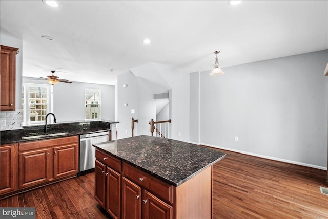 4631 Alliance Way, Fredericksburg, VA 22408 - kitchen with stainless steel dishwasher, dark wood-style flooring, a ceiling fan, a kitchen island, and recessed lighting