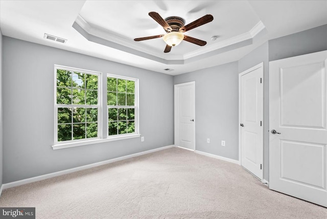 4631 Alliance Way, Fredericksburg, VA 22408 - unfurnished bedroom featuring a tray ceiling, ornamental molding, carpet flooring, and ceiling fan