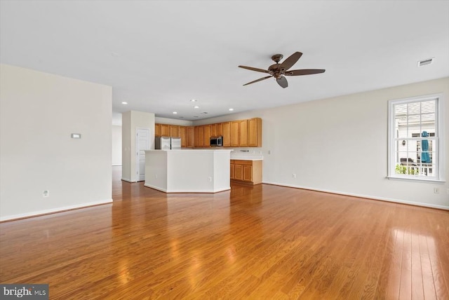 5307 Philippi Pl W, Fredericksburg, VA 22407 - unfurnished living room with light wood-style flooring, a ceiling fan, and recessed lighting