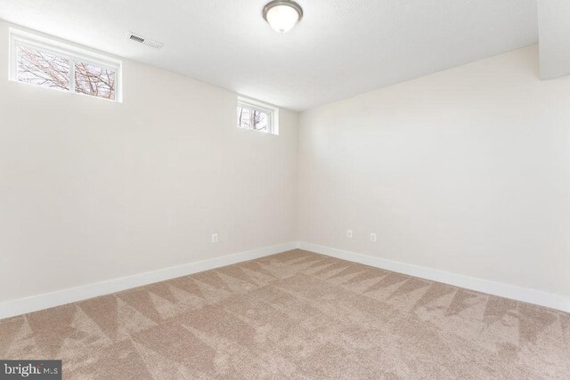 corridor with an upstairs landing, wood finished floors, recessed lighting, and baseboards