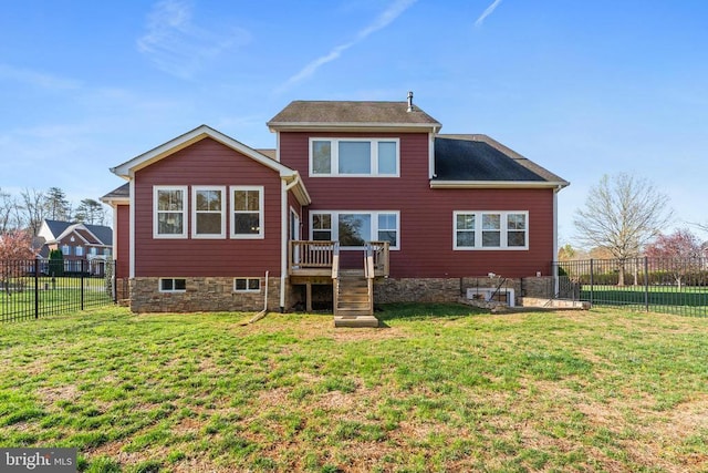 rear view of house with a wooden deck and stairs