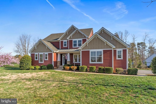 craftsman-style house with board and batten siding and a front yard