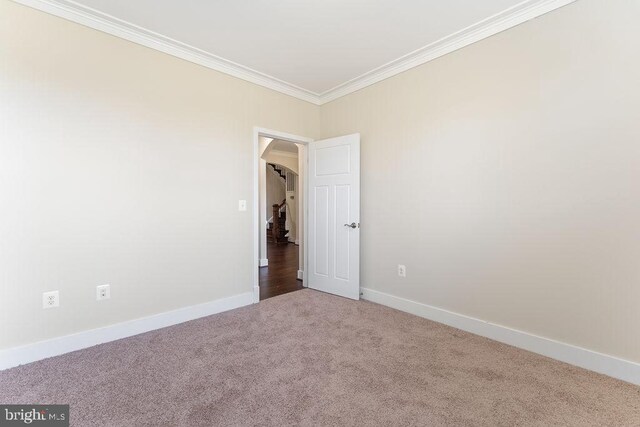 below grade area with a textured ceiling, carpet, and baseboards