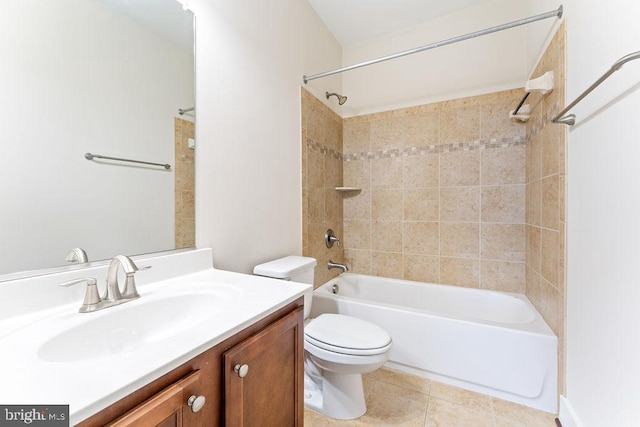 bathroom with toilet, tile patterned floors,  shower combination, and vanity