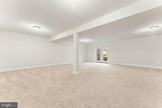 unfurnished living room with arched walkways, a chandelier, a high ceiling, a fireplace, and dark wood-style floors