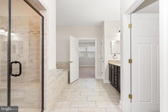 unfurnished bedroom featuring baseboards, carpet floors, a closet, and connected bathroom