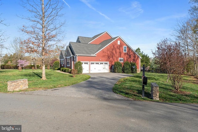 view of home's exterior with asphalt driveway and a lawn
