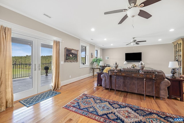 2055 Thomas Jefferson Pkwy, Charlottesville, VA 22902 - living room with a ceiling fan, baseboards, ornamental molding, light wood finished floors, and visible vents