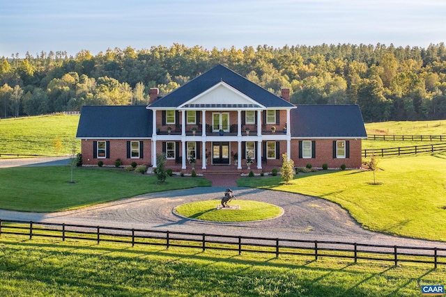 2055 Thomas Jefferson Pkwy, Charlottesville, VA 22902 - view of front of property featuring fence, a chimney, a front yard, and curved driveway