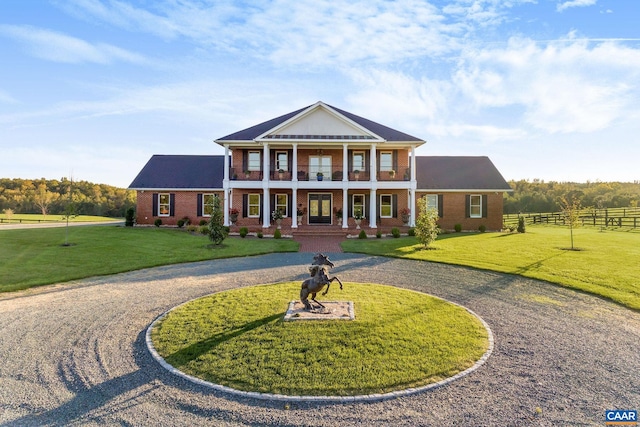 2055 Thomas Jefferson Pkwy, Charlottesville, VA 22902 - greek revival inspired property featuring fence, curved driveway, a front lawn, a porch, and brick siding