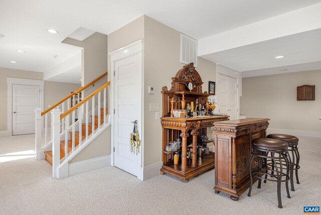 2055 Thomas Jefferson Pkwy, Charlottesville, VA 22902 - bar featuring visible vents, baseboards, stairway, light carpet, and recessed lighting