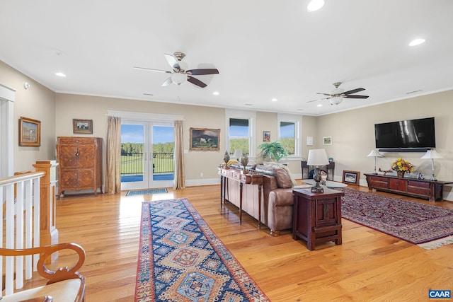 2055 Thomas Jefferson Pkwy, Charlottesville, VA 22902 - living room featuring light wood finished floors, a ceiling fan, and a healthy amount of sunlight