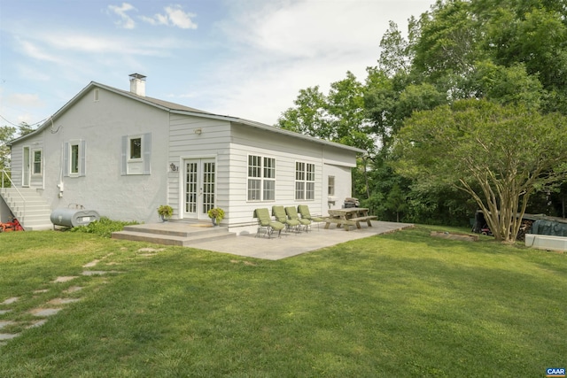 5072 Scottsville Rd, Charlottesville, VA 22902 - back of house with french doors, a yard, a chimney, and a patio area