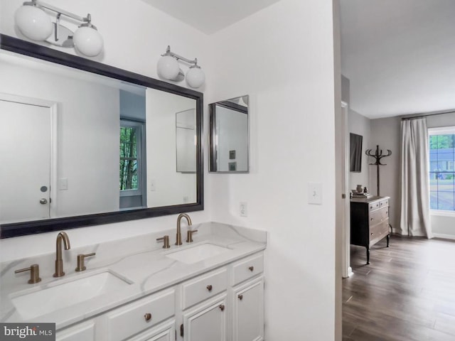 11600 Saddleback Dr, Fredericksburg, VA 22407 - bathroom featuring double vanity, wood finished floors, and baseboards
