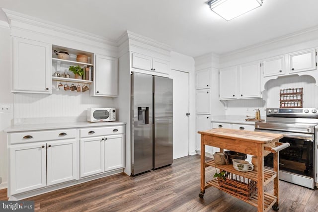 11600 Saddleback Dr, Fredericksburg, VA 22407 - kitchen featuring appliances with stainless steel finishes, light countertops, white cabinetry, dark wood finished floors, and open shelves