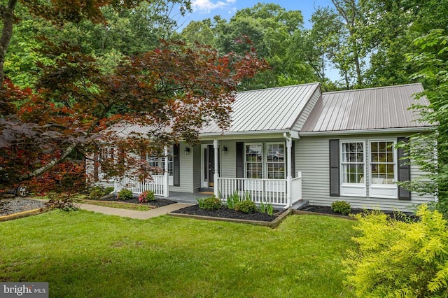 11600 Saddleback Dr, Fredericksburg, VA 22407 - single story home featuring metal roof, a front yard, a porch, and a standing seam roof