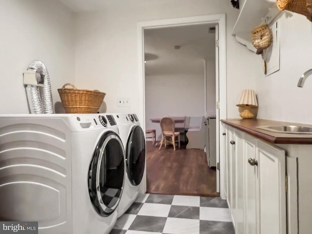 11600 Saddleback Dr, Fredericksburg, VA 22407 - laundry room with cabinet space, washer and dryer, and dark flooring