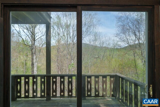 7035 Blackwells Hollow Rd, Crozet, VA 22932 - wooden deck with a wooded view