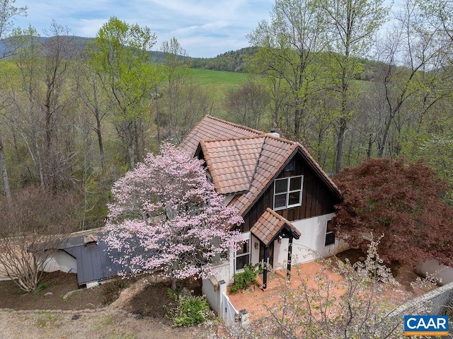 7035 Blackwells Hollow Rd, Crozet, VA 22932 - view of property exterior with a tile roof and a forest view