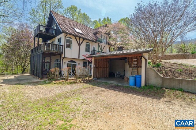 7035 Blackwells Hollow Rd, Crozet, VA 22932 - back of house with a balcony, a chimney, and fence