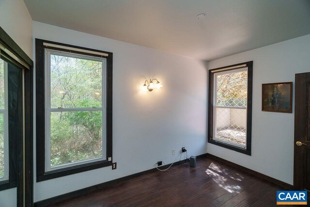 7035 Blackwells Hollow Rd, Crozet, VA 22932 - empty room featuring plenty of natural light, dark wood-type flooring, and baseboards