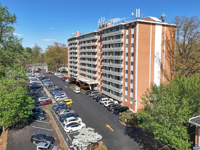 view of property with uncovered parking