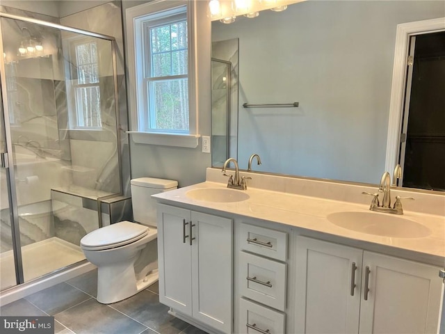 310 Hunt Hvn, Mineral, VA 23117 - full bath featuring toilet, a shower stall, double vanity, tile patterned floors, and a spacious closet