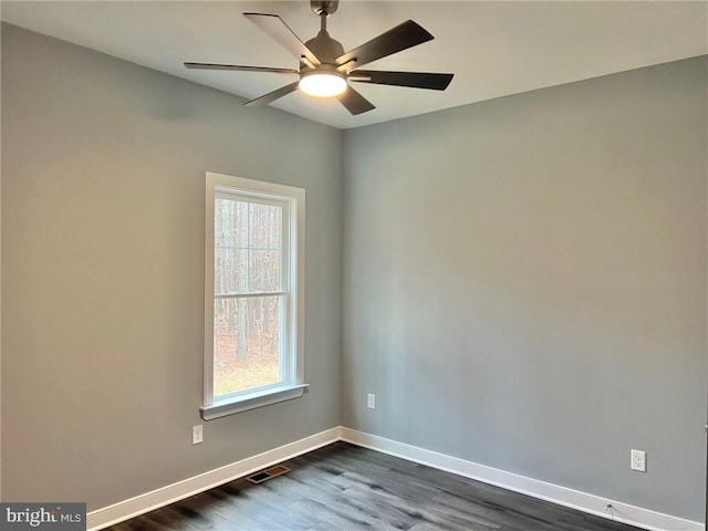 310 Hunt Hvn, Mineral, VA 23117 - empty room featuring healthy amount of natural light, dark wood-type flooring, baseboards, and a ceiling fan