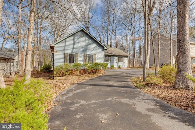 view of front of home featuring asphalt driveway