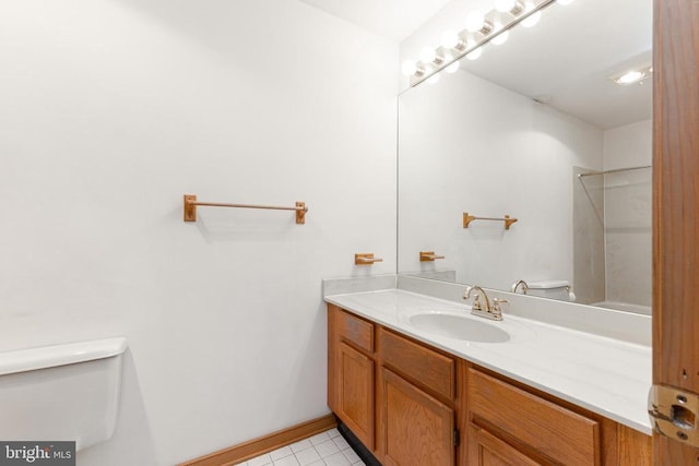 full bathroom featuring toilet, vanity, tile patterned flooring, a shower, and baseboards