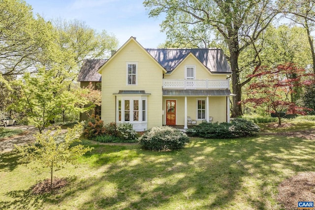 1112 Park St, Charlottesville, VA 22901 - traditional-style home featuring covered porch, a front lawn, and a balcony