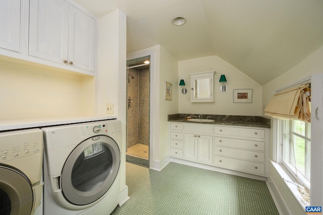 1112 Park St, Charlottesville, VA 22901 - laundry room featuring separate washer and dryer, cabinet space, and light tile patterned floors