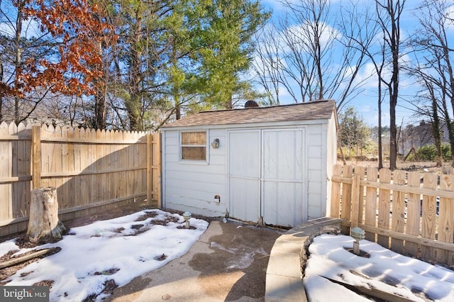 view of shed with a fenced backyard