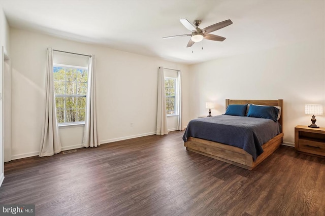  - bedroom with multiple windows, wood finished floors, and ceiling fan