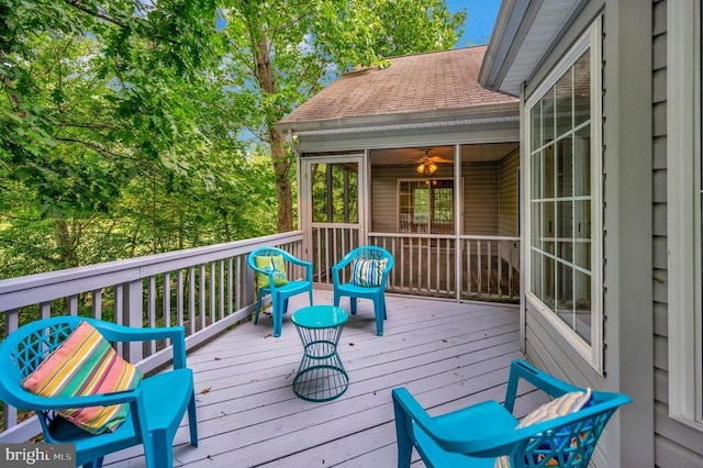 wooden deck with a sunroom