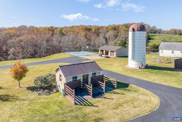 birds eye view of property with a wooded view