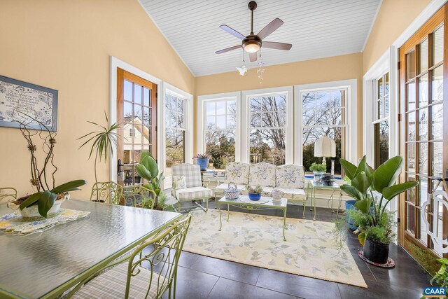 sunroom / solarium featuring vaulted ceiling, wooden ceiling, and french doors
