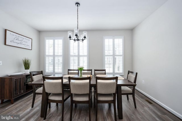 4114 Bolton Ct, Fredericksburg, VA 22408 - dining room with a chandelier, dark wood-type flooring, and baseboards