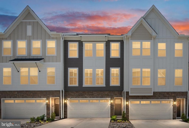 4114 Bolton Ct, Fredericksburg, VA 22408 - townhome / multi-family property with board and batten siding, a garage, and driveway