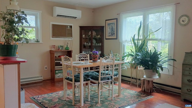 983 Williamstown Rd, Shipman, VA 22971 - dining room featuring a wall mounted air conditioner, a baseboard radiator, and wood finished floors