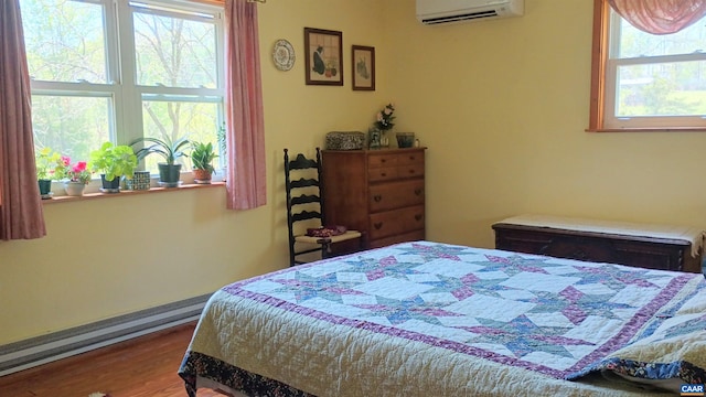 983 Williamstown Rd, Shipman, VA 22971 - bedroom featuring a wall mounted AC and wood finished floors
