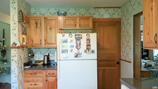 983 Williamstown Rd, Shipman, VA 22971 - kitchen featuring freestanding refrigerator, wallpapered walls, dark countertops, and crown molding