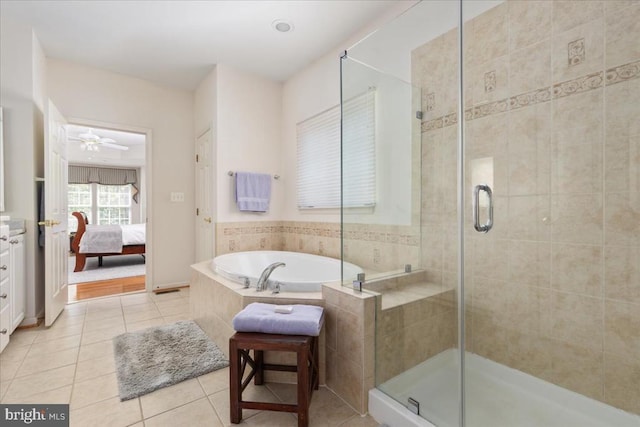  - ensuite bathroom featuring a stall shower, ensuite bath, tile patterned floors, and a garden tub