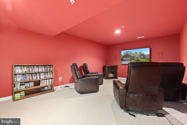  - home theater room featuring baseboards, carpet flooring, and visible vents