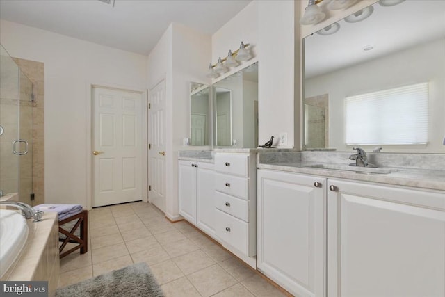  - full bath with a stall shower, tile patterned flooring, vanity, and tiled bath