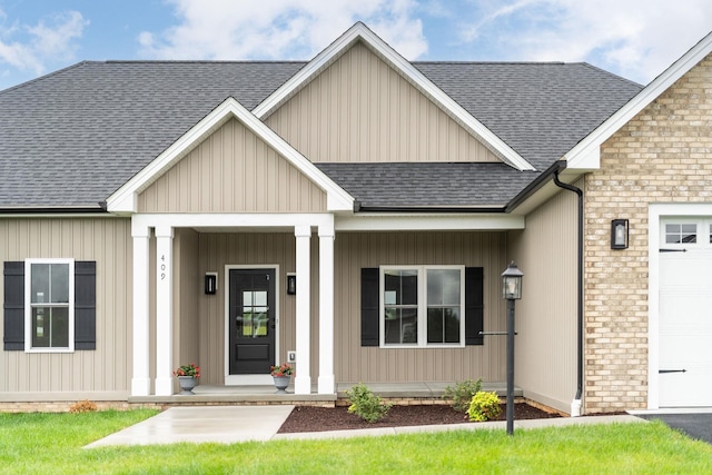 409 Peterson Ln, Waynesboro, VA 22980 - view of front of house with a shingled roof, a garage, and covered porch