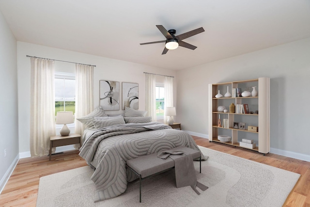 409 Peterson Ln, Waynesboro, VA 22980 - bedroom with light wood-style floors, baseboards, and a ceiling fan
