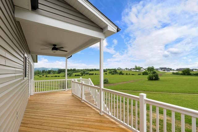 409 Peterson Ln, Waynesboro, VA 22980 - wooden deck featuring a ceiling fan, a yard, and a view of countryside